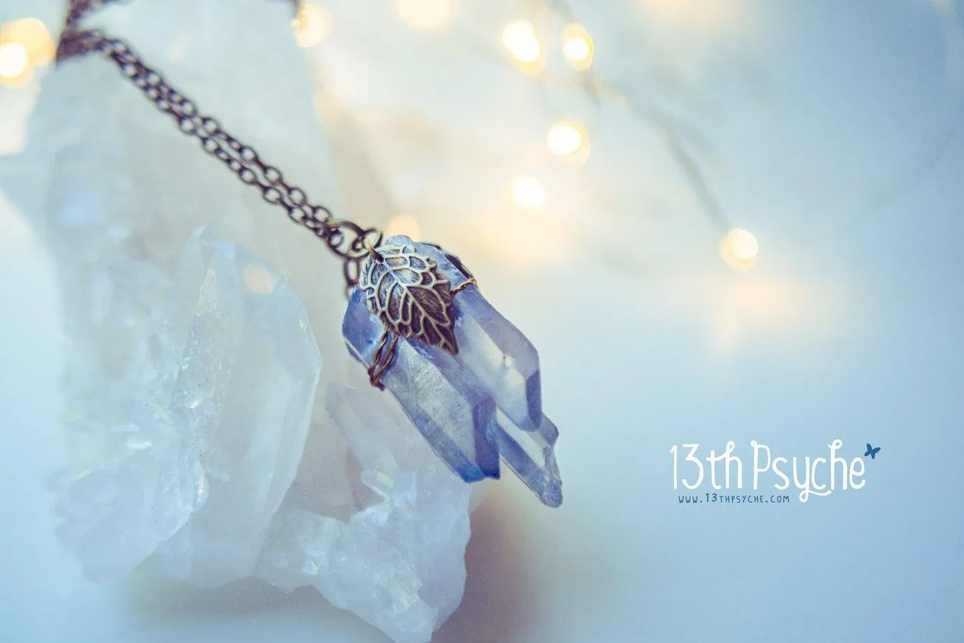 Colorful raw quartz crystal point pendant necklace with leaves