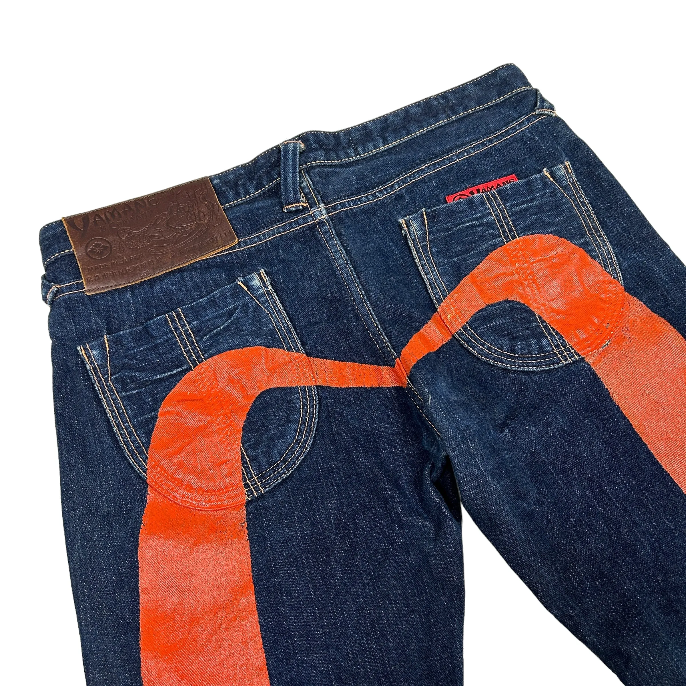 EVISU ORANGE FLARE DAICOCK JEANS