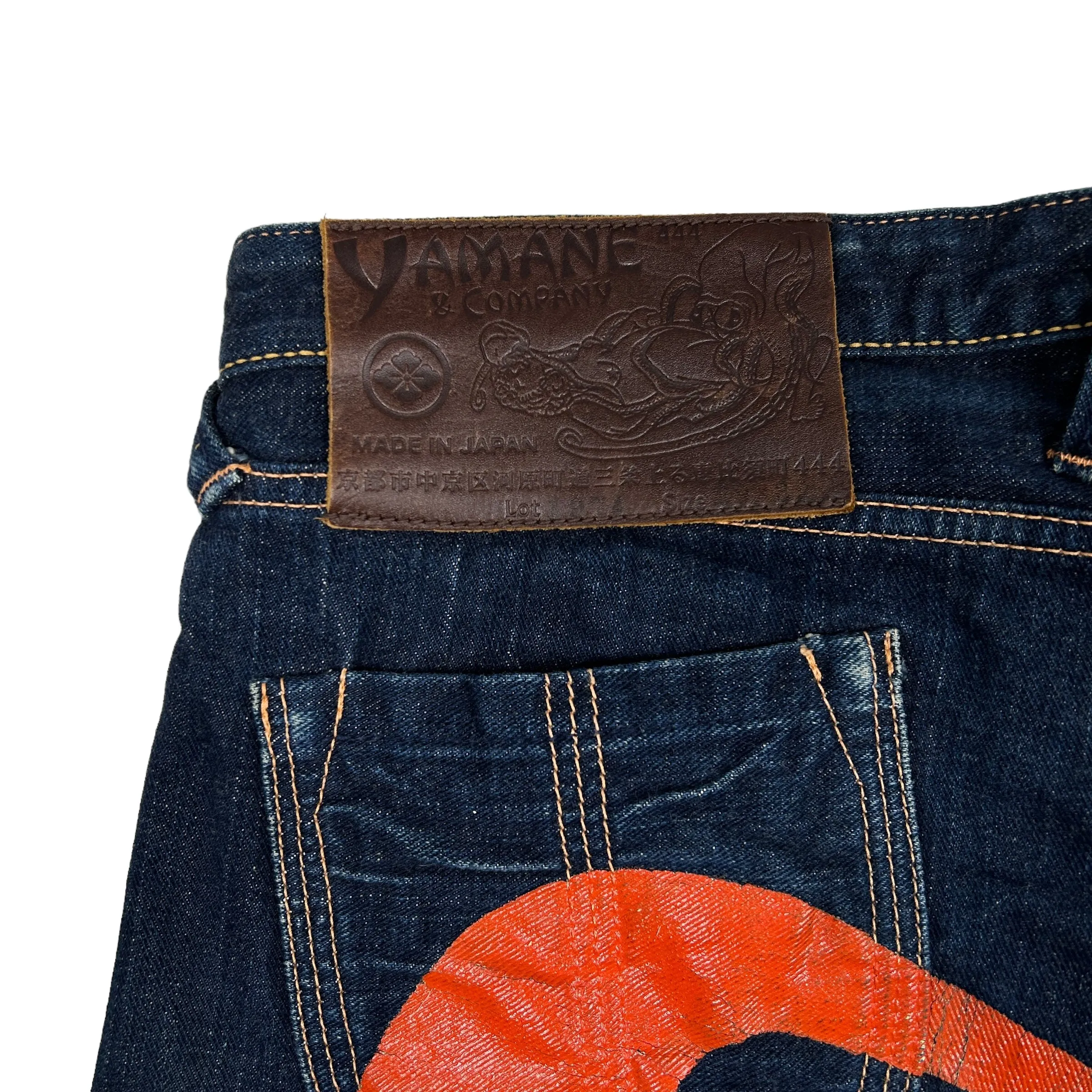 EVISU ORANGE FLARE DAICOCK JEANS